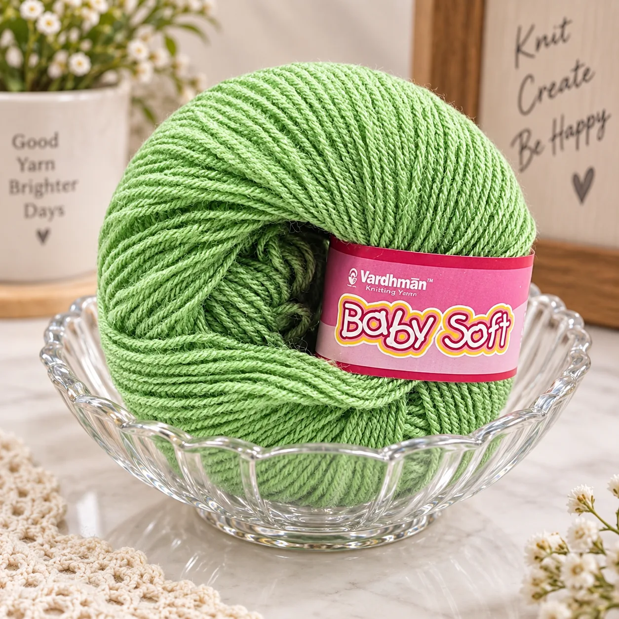 Green Baby Soft yarn ball on a glass bowl