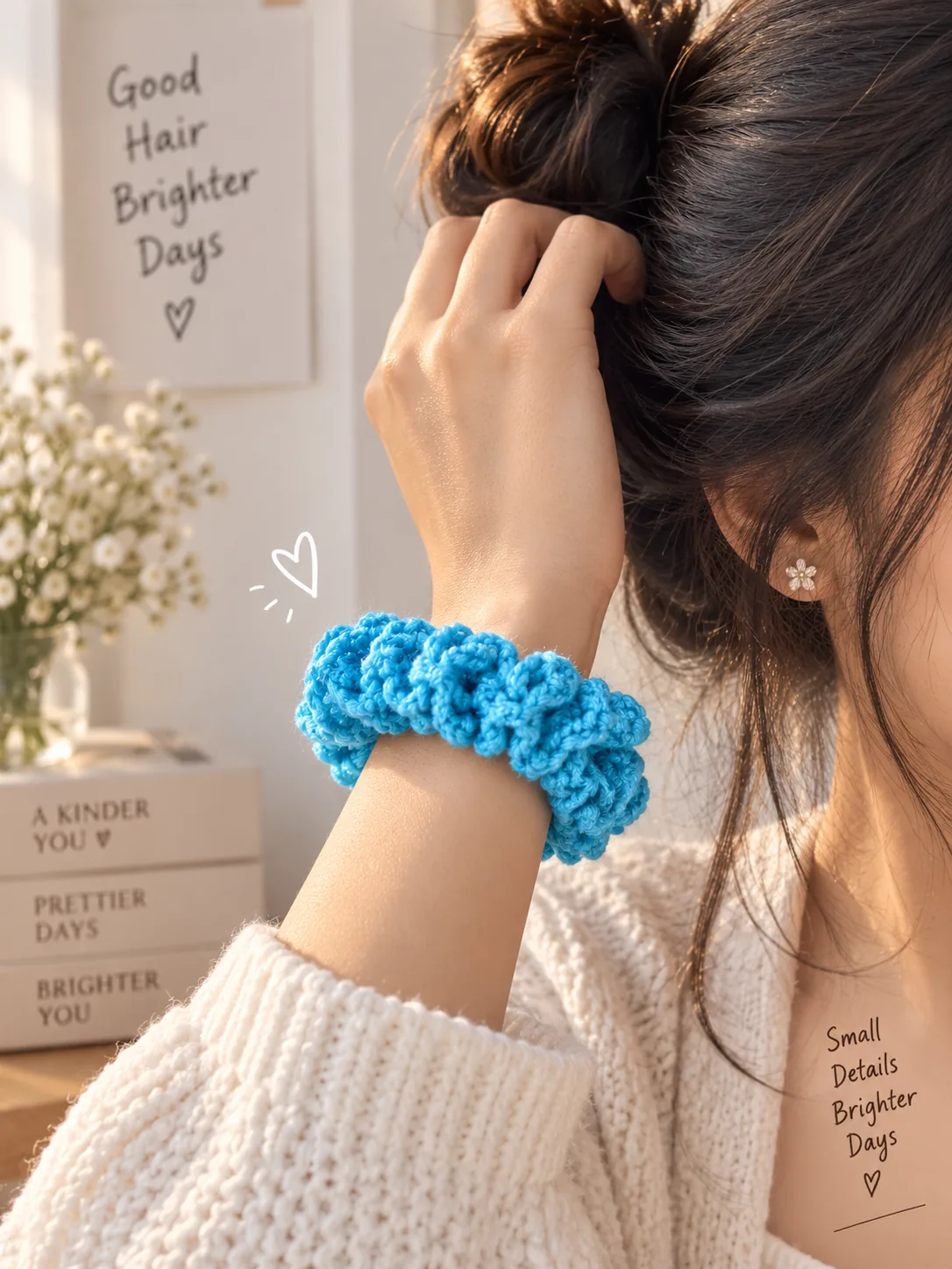 Blue crochet scrunchie worn on the wrist